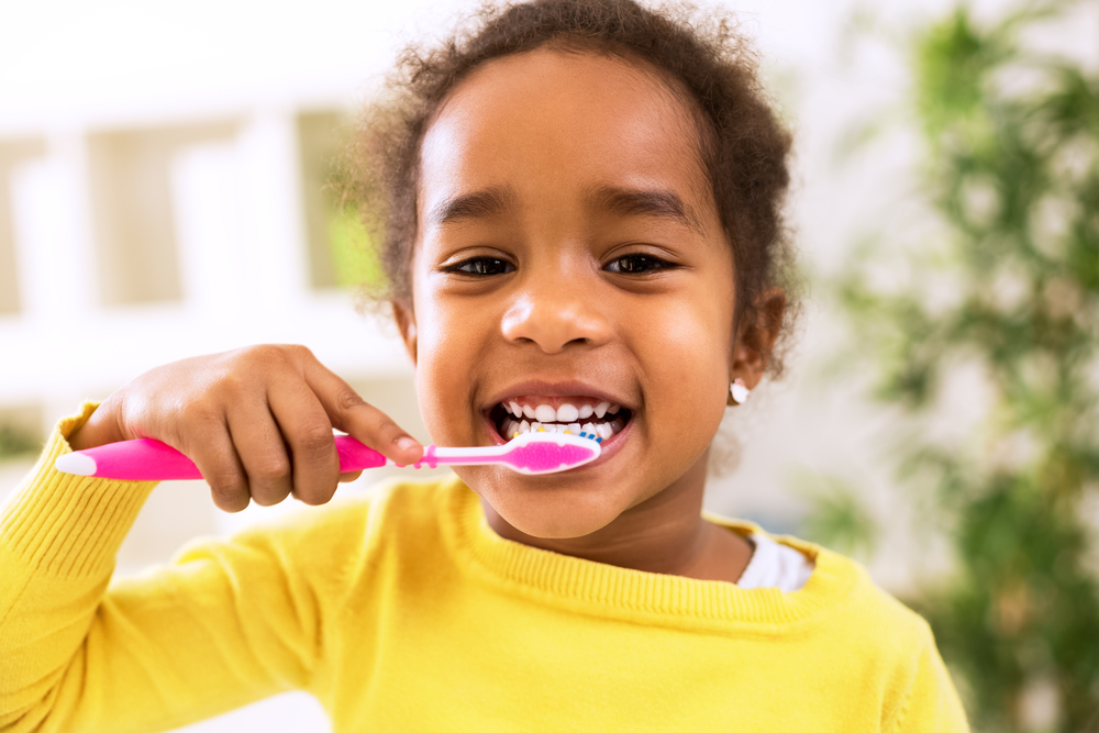 Happy child brushing.